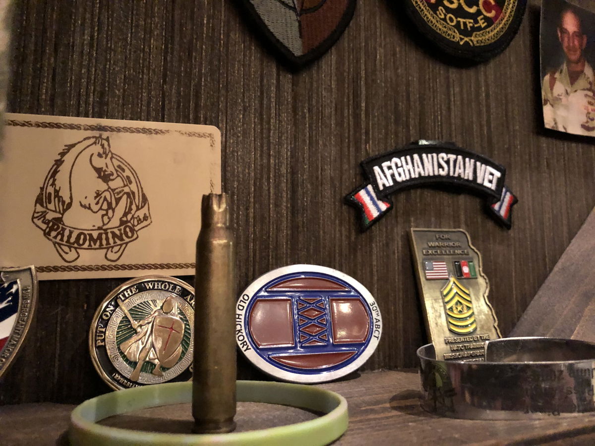 A WWII shell casing is one of many authentic military mementos used as a stage prop in Last Out Elegy of a Green Beret.