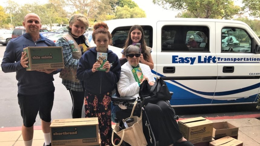 From left - Easy Lift Driver Jimmy Owens, Girl Scout Troop 55504 members Ruby Romo, Grace McElroy, and Maxine Nocker, with and passenger Marie Campbell[1] copy