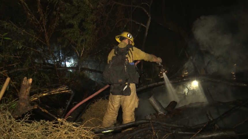 Firefighters put out encampment fire
