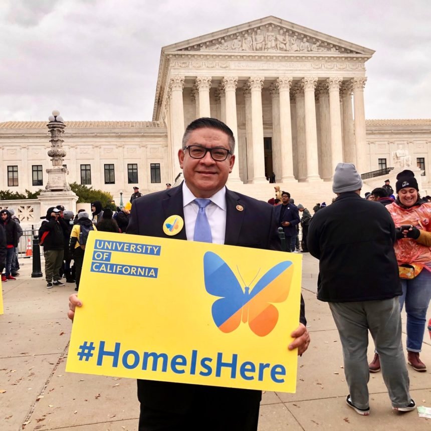 carbajal holds up a sign in support of dreamers.