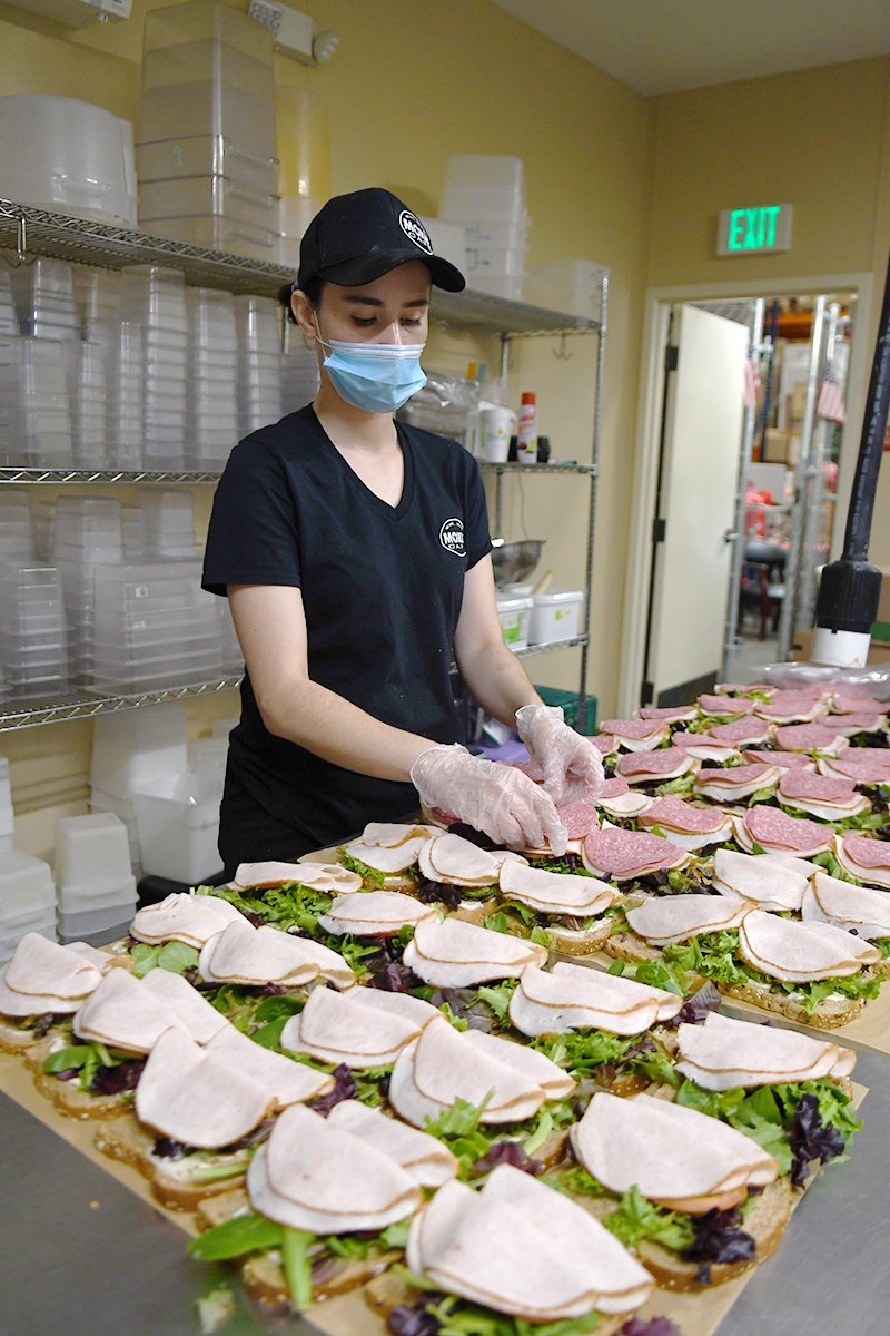 santa maria valley tourism provides meals to first responders prepping sandwiches