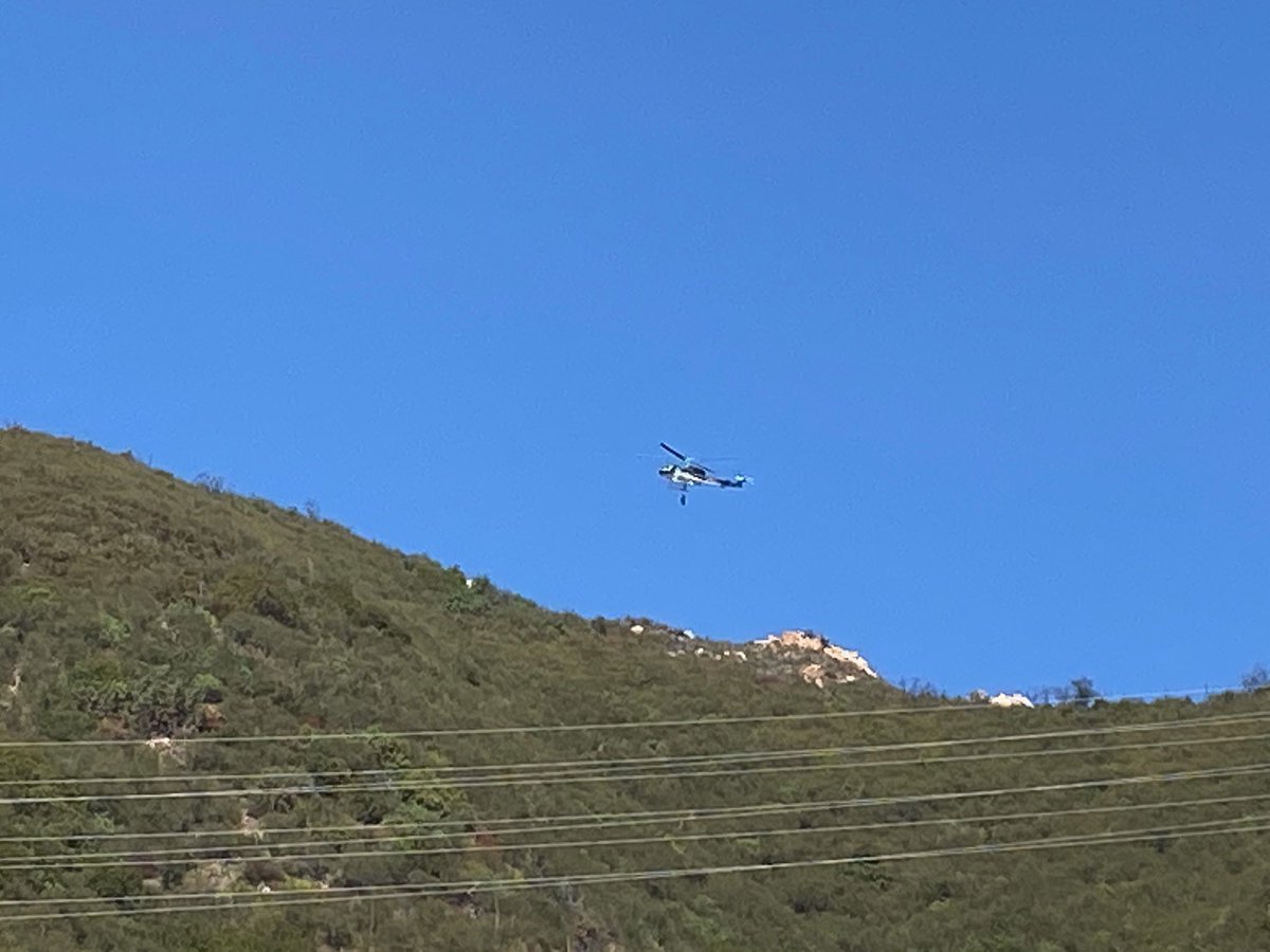 A paraglider was hoisted to safety after crashing on Gibraltar Road. 