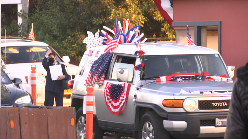 Cars decorated for Veterans Day drive-in