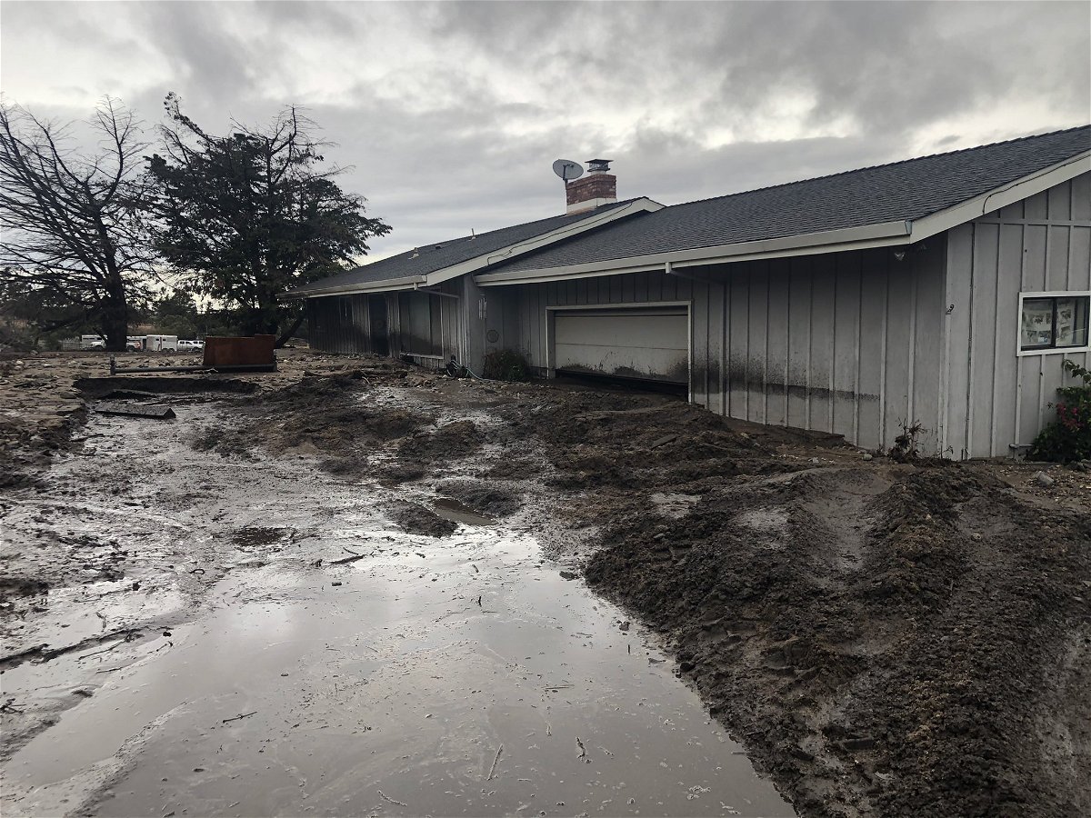 This photo shows a home surrounded by mud on River Road. It is not known if a rescue was conducted at this specific home.