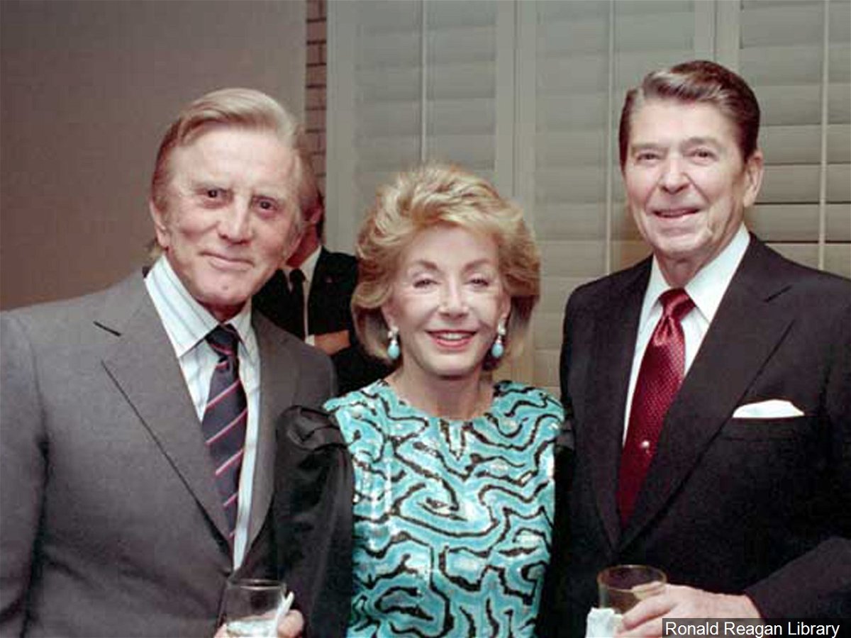 Anne Douglas and husband Kirk meeting President Ronald Reagan.