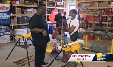 Matthew Roundtree (left) and Marvin Parker (right) are among the first group of high school graduates taking part in a new apprenticeship program designed to help them get jobs.
