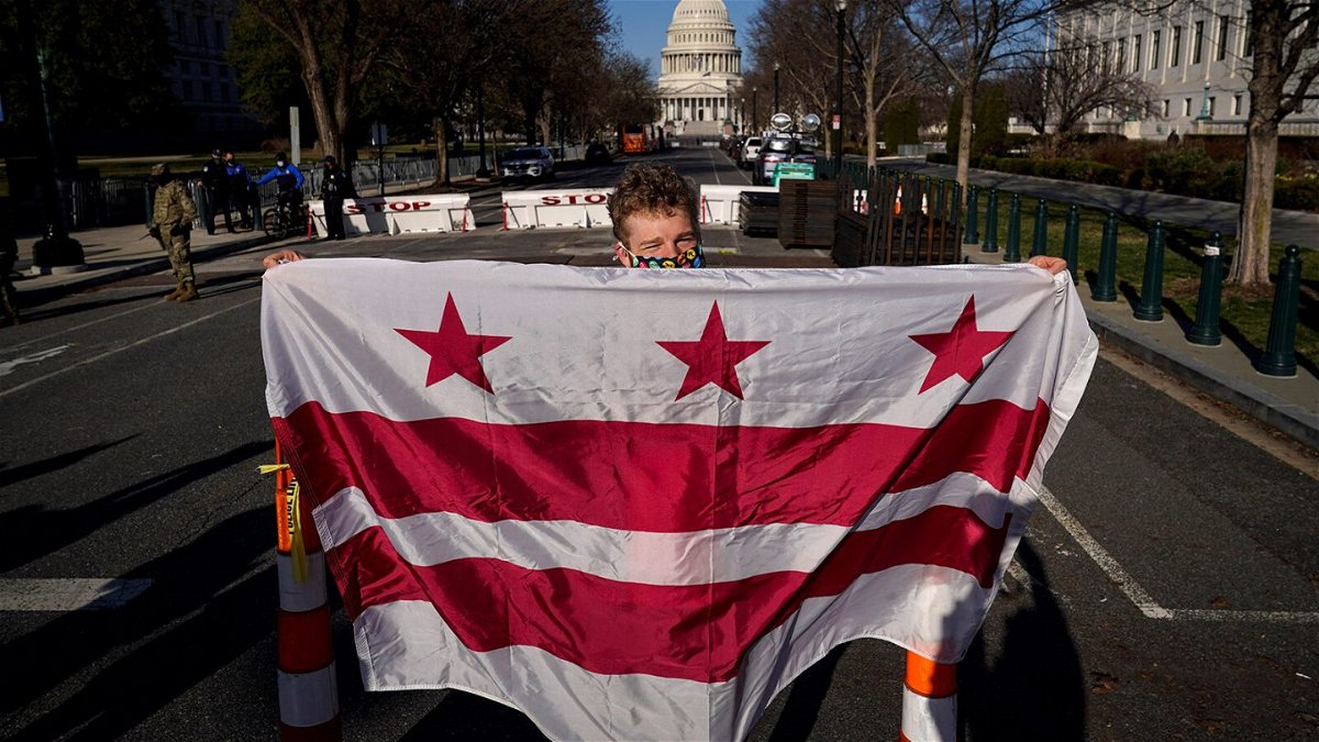 <i>Drew Angerer/Getty Images</i><br/>Residents of the District of Columbia rally for statehood near the U.S. Capitol on March 22 in Washington