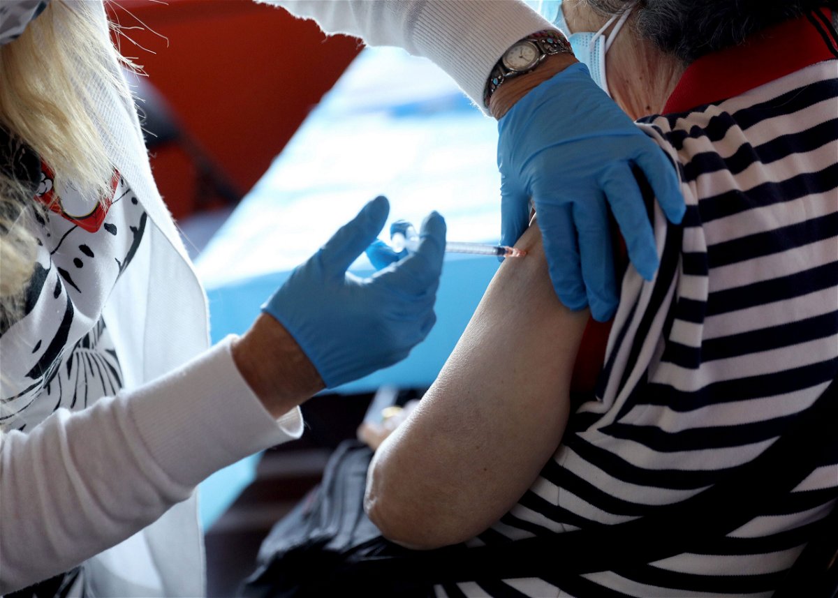 <i>Monica Schipper/Getty Images</i><br/>A healthcare worker administers the vaccine as the Empire State Building offers Covid-19 vaccines at its observatory on June 18
