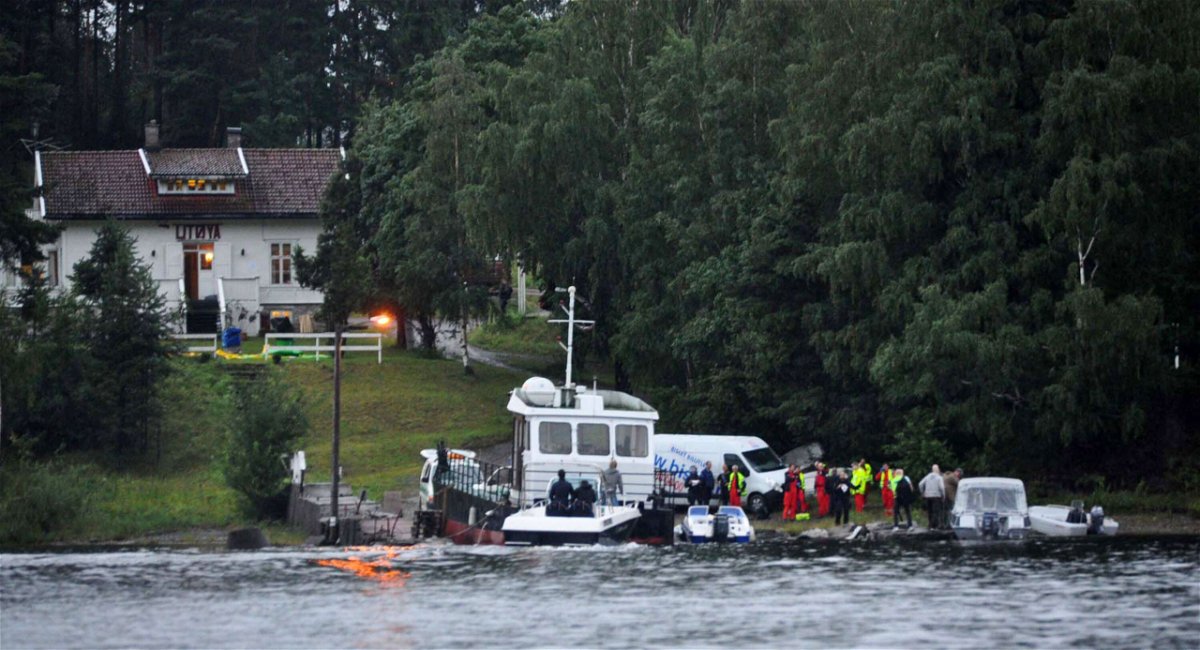 <i>Vegard M. Aas/presse30.no/Getty Images</i><br/>Police and emergency services gather following the massacre at a summer youth camp on July 22
