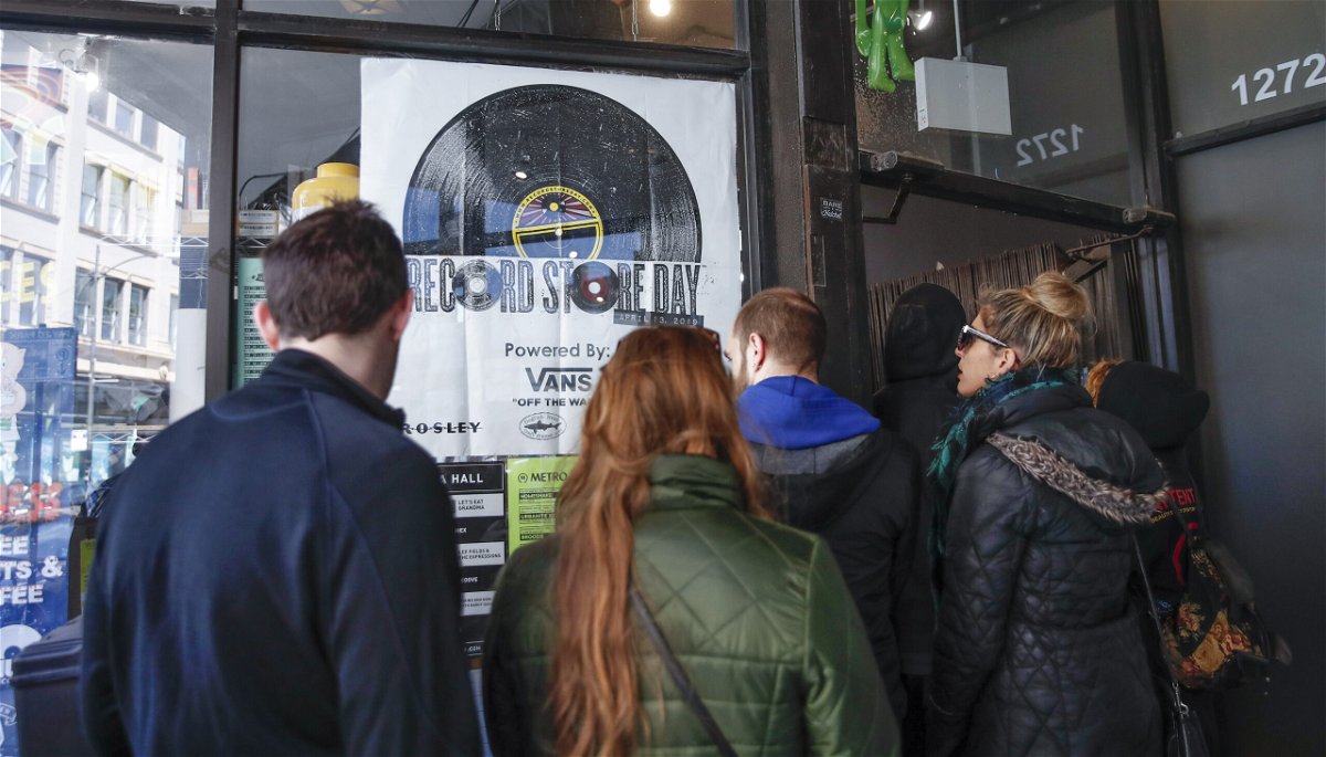 <i>KAMIL KRZACZYNSKI/AFP/AFP/Getty Images</i><br/>Customers wait in line to enter Chicago's Shuga Records on Record Store Day on April 13