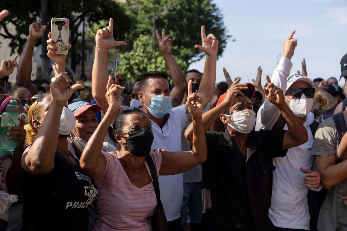 <i>Eliana Aponte/AP</i><br/>Anti-government protesters march in Havana on July 11.