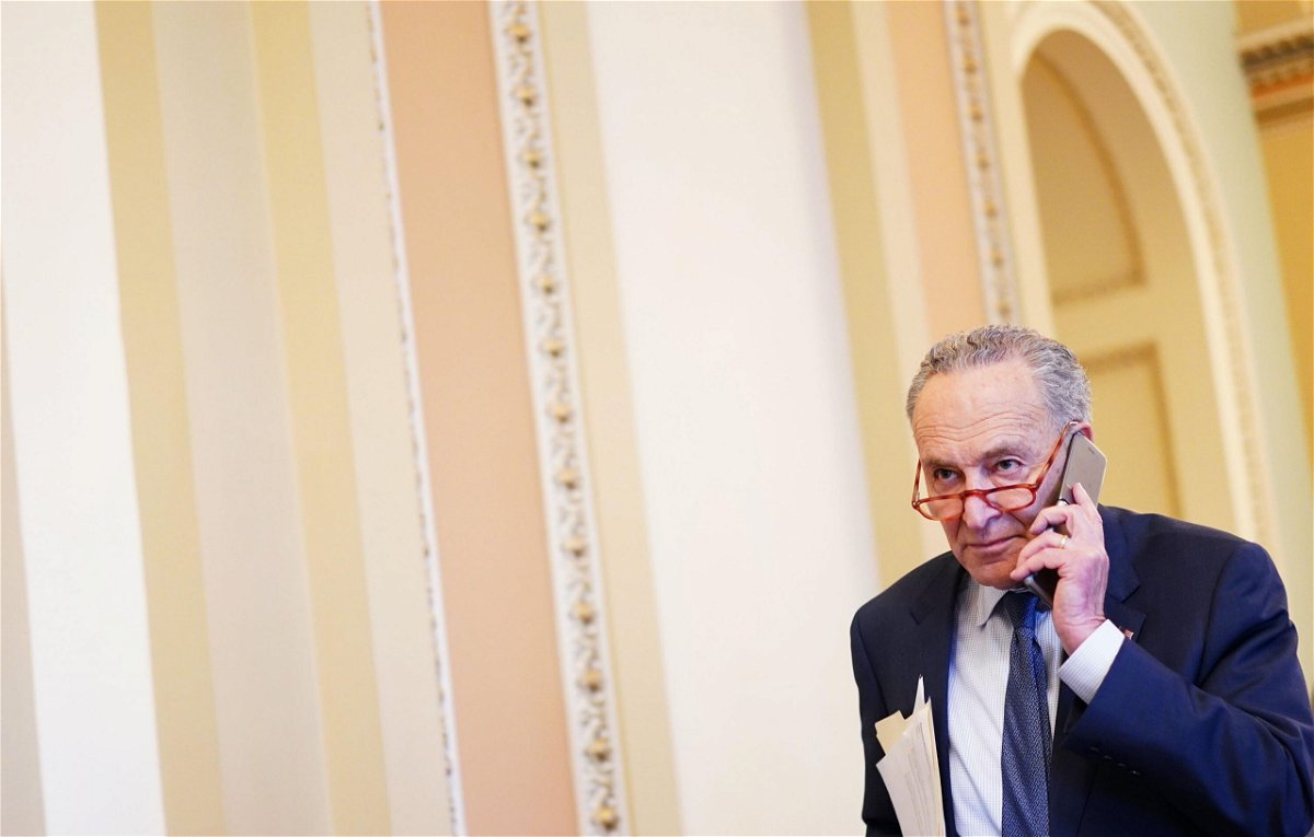 <i>MANDEL NGAN/AFP/Getty Images</i><br/>Schumer talks on his phone before the Senate impeachment vote on Capitol Hill in Washington