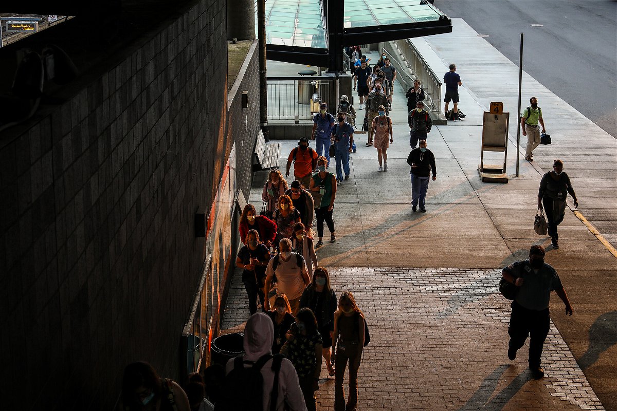 <i>Erin Clark/The Boston Globe/Getty Images</i><br/>Commuters arrive to Ruggles Station in Roxbury