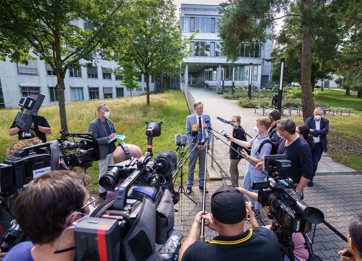 <i>Frank Rumpenhorst/dpa/picture alliance/Getty Images</i><br/>Seven people who ate at a university kitchen showed symptoms of poisoning on Monday. Chief Public Prosecutor Robert Hartmann (center) addresses journalists on Tuesday.