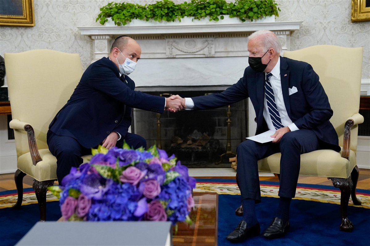 <i>Evan Vucci/AP</i><br/>President Joe Biden shakes hands with Israeli Prime Minister Naftali Bennett as they meet in the Oval Office of the White House