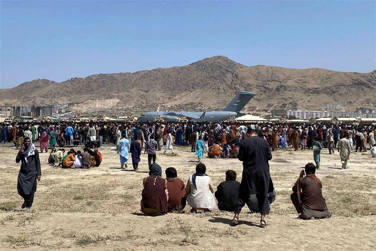 <i>Shekib Rahmani/AP</i><br/>The dangerous and chaotic scenes outside the airport have made it virtually impossible for Afghans to make it onto airport grounds without a connection 
