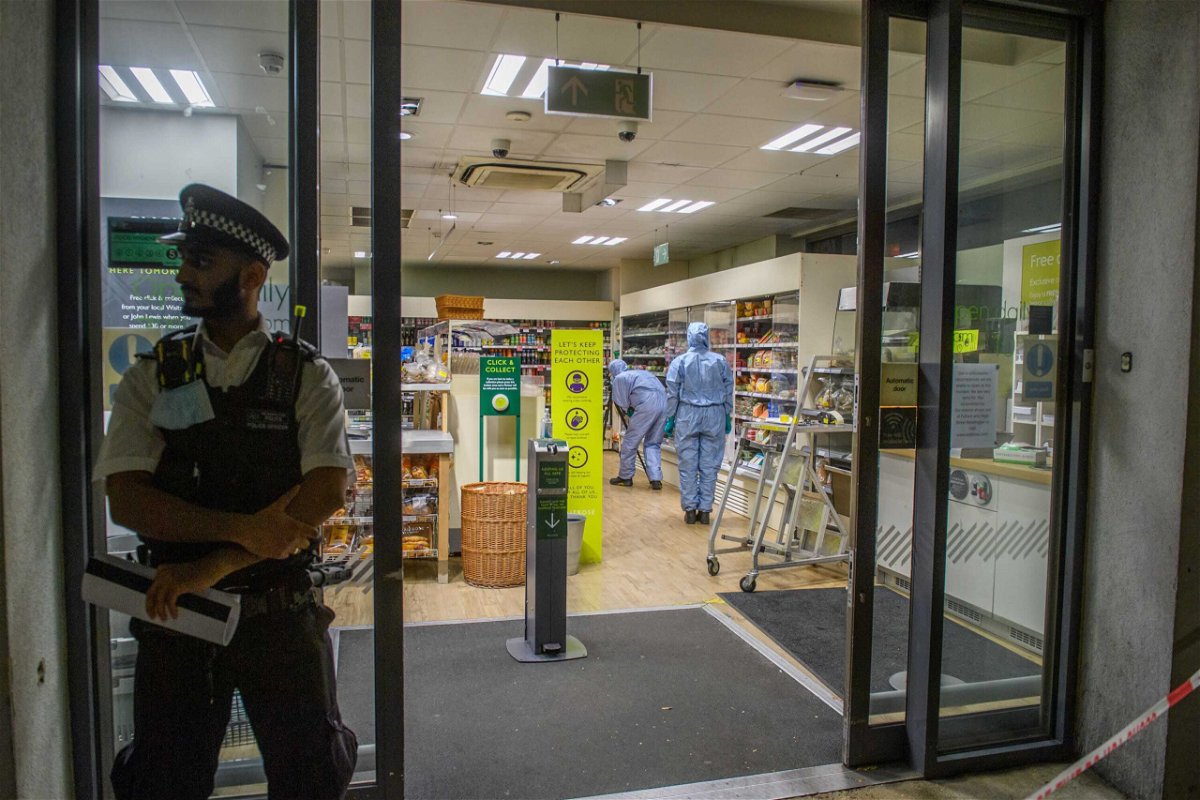 <i>Peter Manning/LNP/Shutterstock</i><br/>A man has been arrested on suspicion of contaminating food at three London stores. Forensic investigators are pictured inside one of the affected supermarkets.