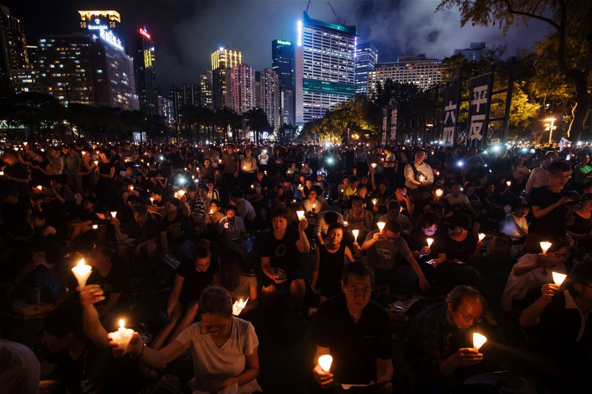 <i>Paul Yeung/Bloomberg/Getty Images</i><br/>Hong Kong national security police are investigating Tiananmen Square vigil organizers. Attendees here gather at a vigil to commemorate the Tiananmen Square crackdown in Hong Kong on June 4
