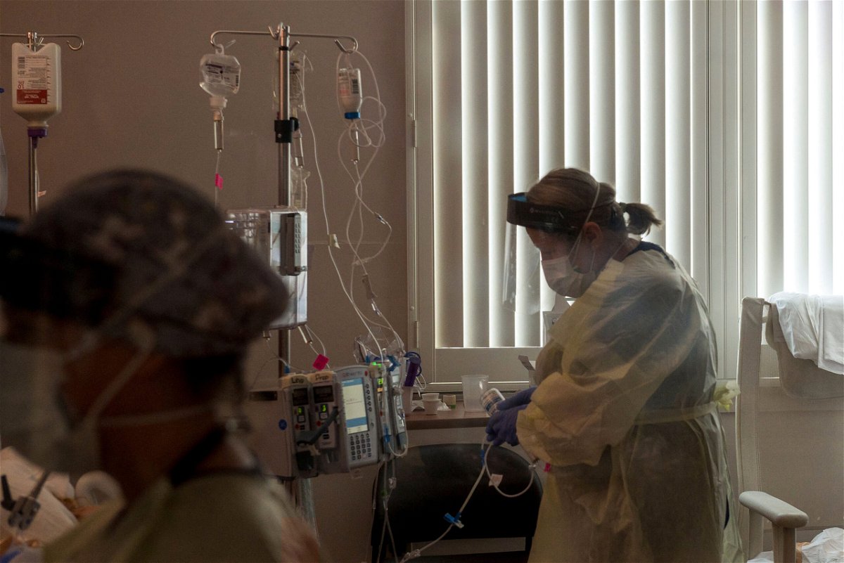<i>Nic Coury/AFP/Getty Images</i><br/>A nurse tends to a Covid-19 patient inside a California ICU.