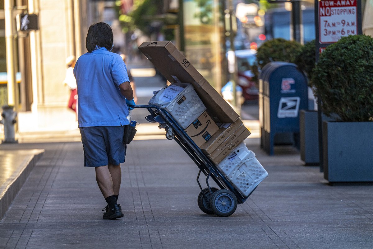 <i>David Paul Morris/Bloomberg/Getty Images</i><br/>Online prices jumped 3.1% year-over-year in July. A U.S. Postal Service worker makes a delivery in San Francisco