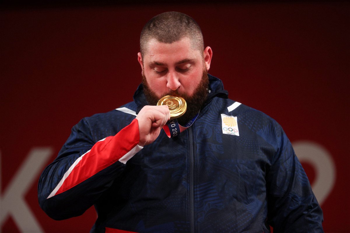 <i>Chris Graythen/Getty Images</i><br/>Gold medalist Lasha Talakhadze of Team Georgia poses with the gold medal during the medal ceremony for the Weightlifting - Men's 109kg+ Group on day 12 of the Tokyo 2020 Olympic Games.