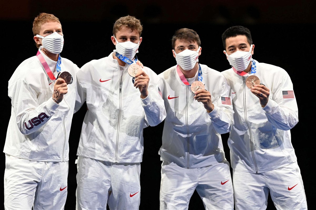 <i>Mohd Rasfan/AFP/Getty Images</i><br/>Race Imboden and his US teammates pose with their bronze medals at the 2020 Summer Olympics in Tokyo