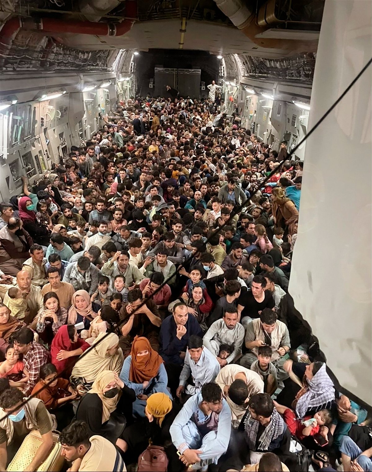 <i>Capt. Chris Herbert/US Air Force/AP</i><br/>Afghan citizens pack inside a U.S. Air Force C-17 Globemaster III as they are transported from Hamid Karzai International Airport in Afghanistan