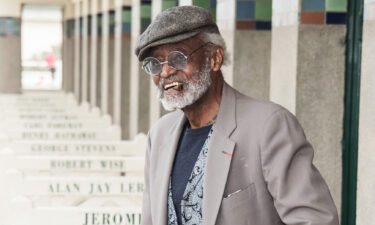 Melvin Van Peebles poses next to the beach closet dedicated to him on the Promenade des Planches in 2012 in Deauville