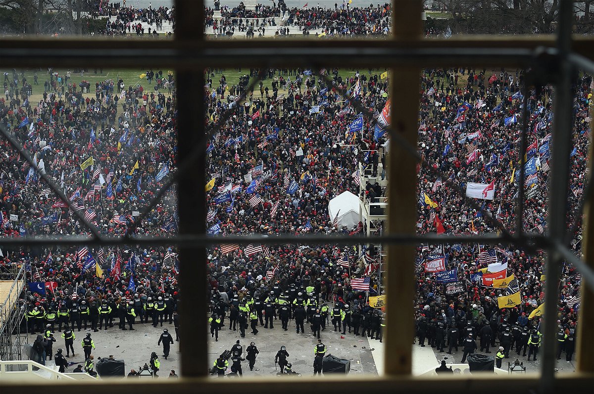 <i>Olivier Douliery/AFP/Getty Images</i><br/>A pro-Trump supporter police officer told those under his command not to wear riot gear on January 6. This image shows rioters gathering outside the US Capitol's Rotunda on January 6
