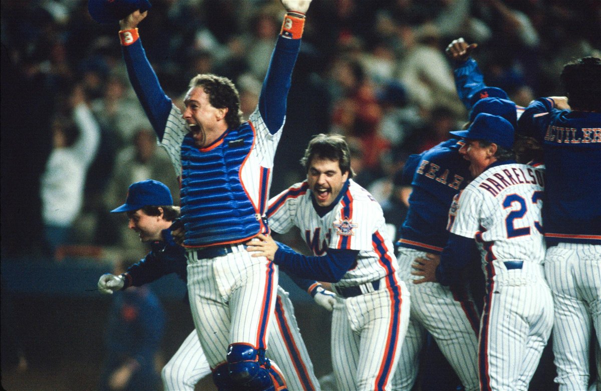 <i>MLB Photos/Getty Images/Courtesy of ESPN</i><br/>Gary Carter and Wally Backman celebrate after winning the 1986 World Series between the New York Mets and the Boston Red Sox.