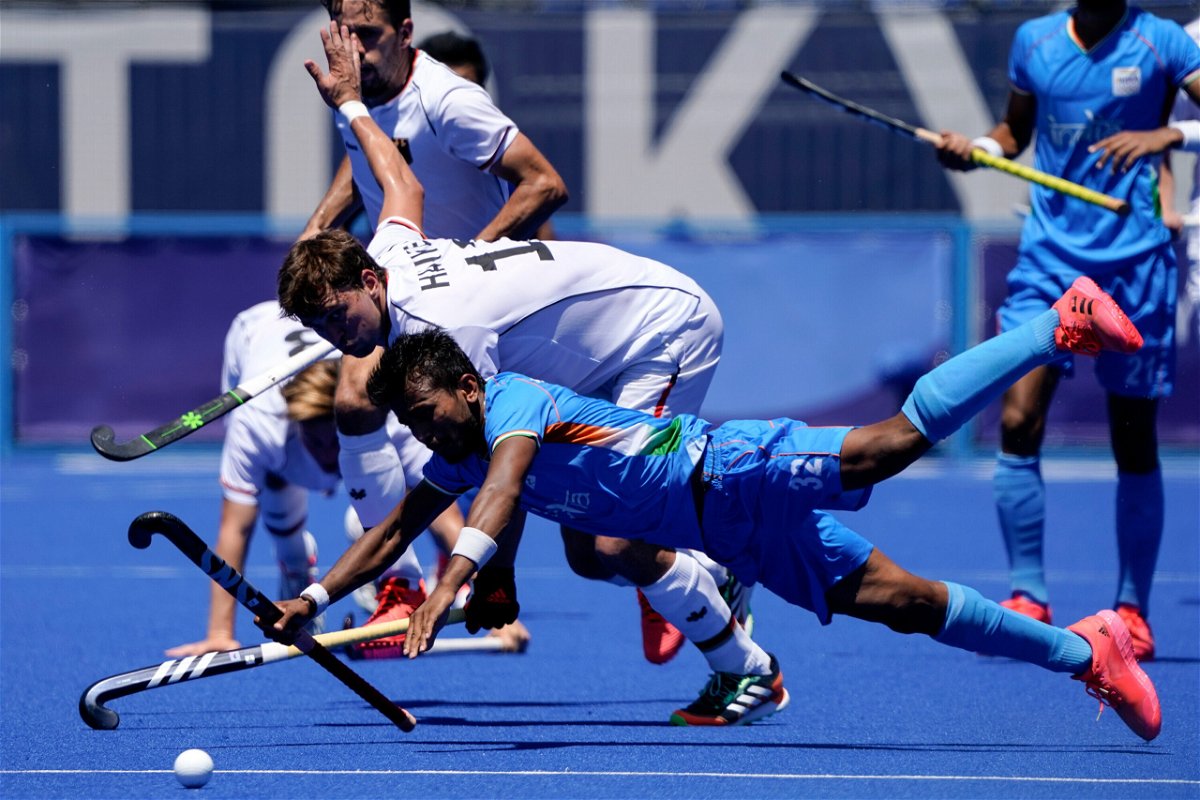 <i>John Minchillo/AP</i><br/>India and Germany's hockey teams compete during the men's hockey bronze medal match.