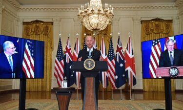 President Joe Biden speaks on national security with British Prime Minister Boris Johnson (L) and Australian Prime Minister Scott Morrison (R) at the White House in Washington