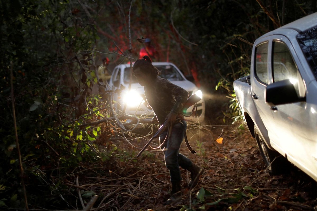 <i>Ueslei Marcelino/Reuters</i><br/>Laercio Guajajara prepares to search for illegal loggers on Arariboia indigenous land near the city of Amarante