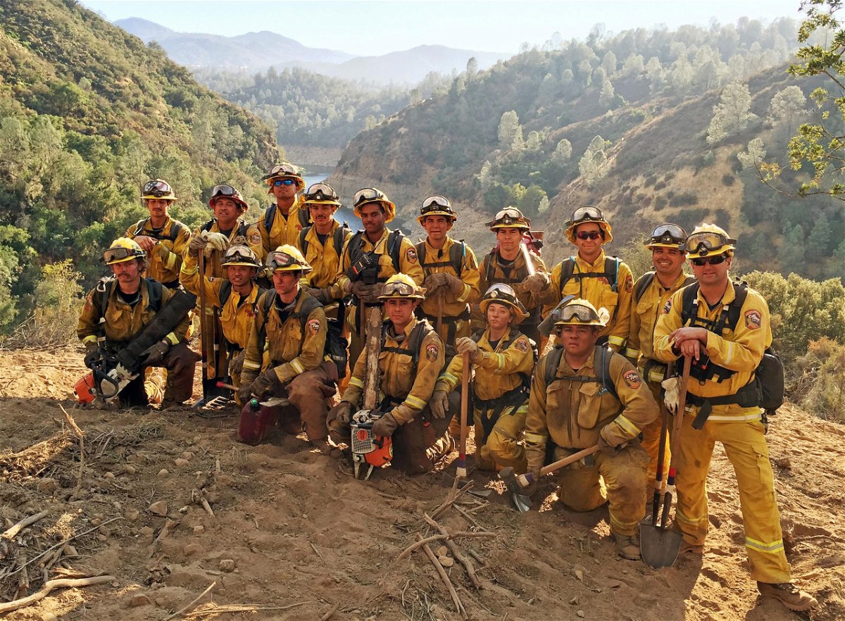 <i>AP</i><br/>A firefighter crew during their deployment in San Luis Obispo County