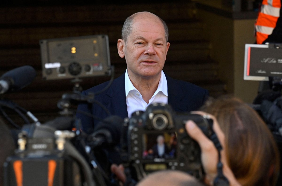 <i>John Macdougall/AFP/Getty Images</i><br/>Olaf Scholz speaks to reporters after voting at a polling station in Potsdam