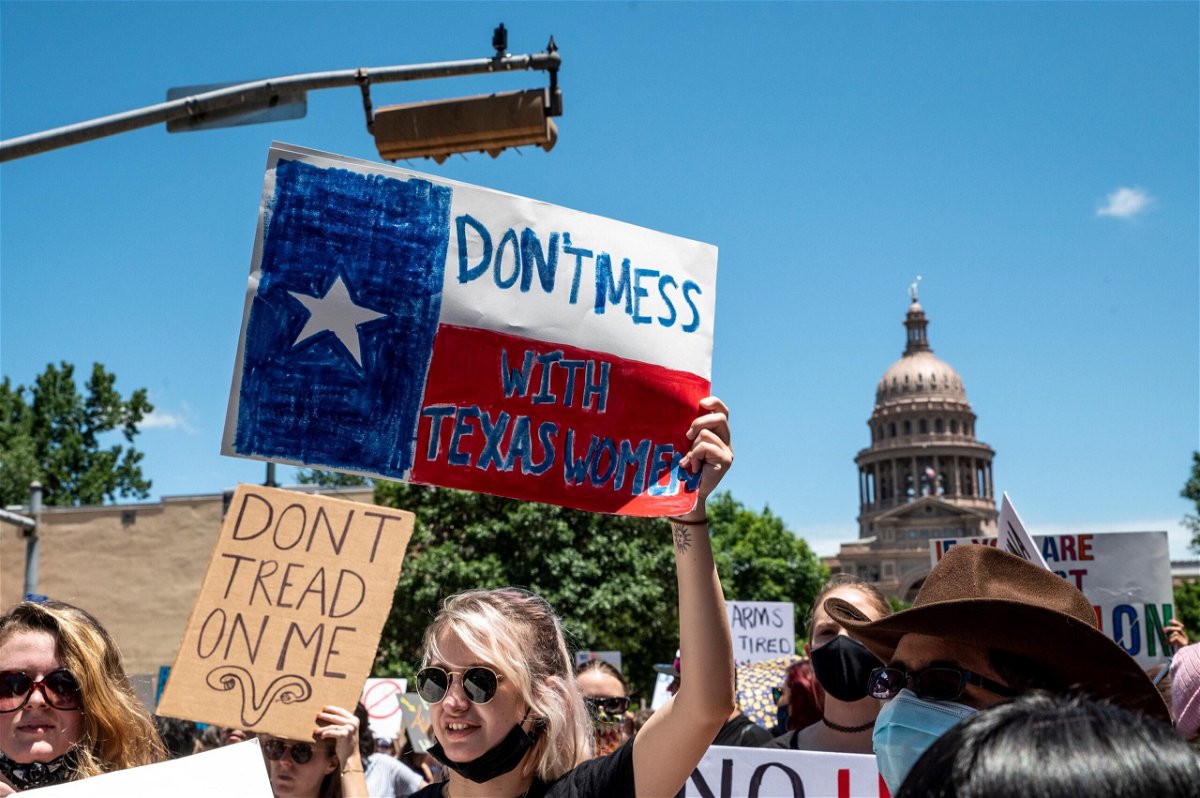 <i>Sergio Flores/Getty Images</i><br/>Texas 6-week abortion ban went into effect early Wednesday.  Abortion protesters here hold up signs as they march down Congress Ave outside the Texas state capitol on May 29