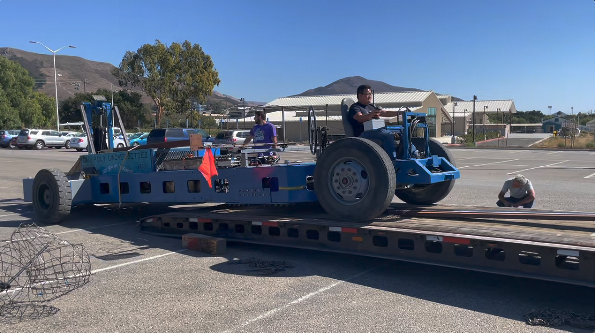 Cal Poly students load Rose Float chassis