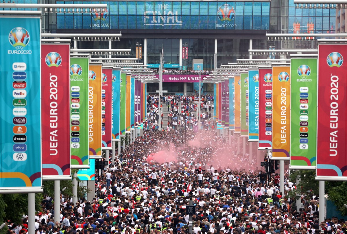 <i>Alex Pantling/Getty Images Europe/Getty Images</i><br/>Supporters walk down Olympic Way ahead of the Euro 2020 final between Italy and England at Wembley Stadium on July 11