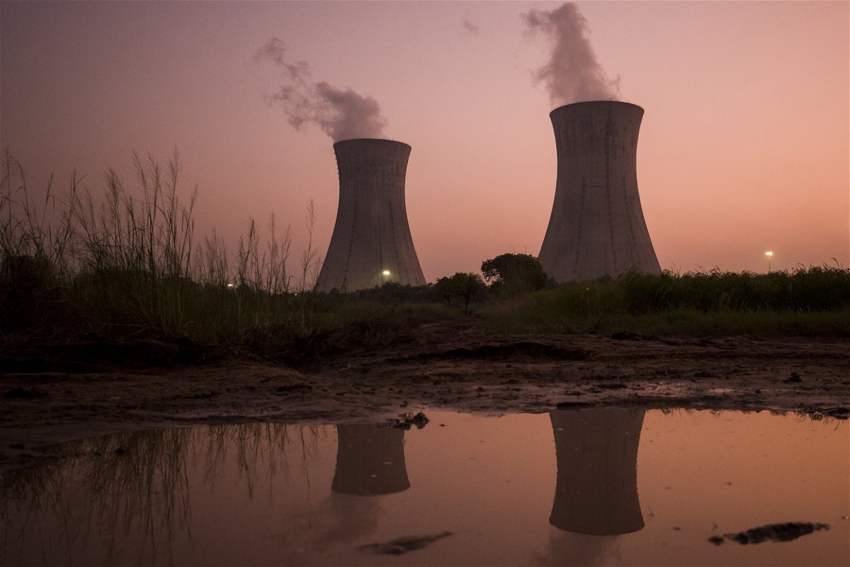<i>Anindito Mukherjee/Bloomberg/Getty Images/FILE</i><br/>Cooling stacks at a coal-fired power plant in Uttar Pradesh
