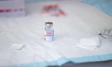 A vial containing Moderna Covid-19 vaccine sits on a table at a clinic for individuals experiencing homelessness at San Julian Park in Los Angeles
