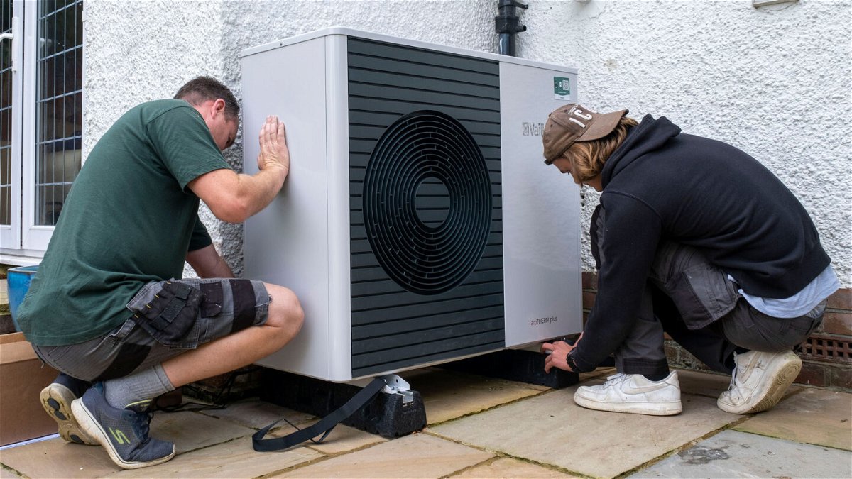 <i>Andrew Aitchison/In pictures via Getty Images</i><br/>Workers from Solaris Energy installing an air source heat pump into a house in Folkestone