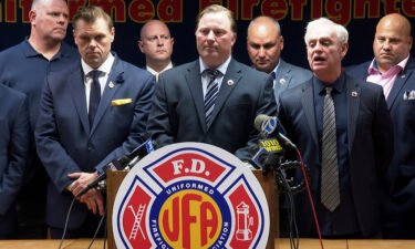 New York fire and police departments are scrambling to cover staff shortages when vaccine mandate takes effect this week. Pictured is the Uniformed Firefighters Association during a news conference in New York City on Wednesday.
