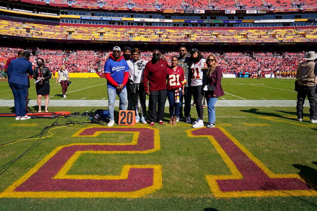 <i>Patrick Semansky/AP</i><br/>Members of the late Sean Taylor's family gather on the field as the Washington Football Team retire his number during a ceremony before the start of an NFL football game against the Kansas City Chiefs