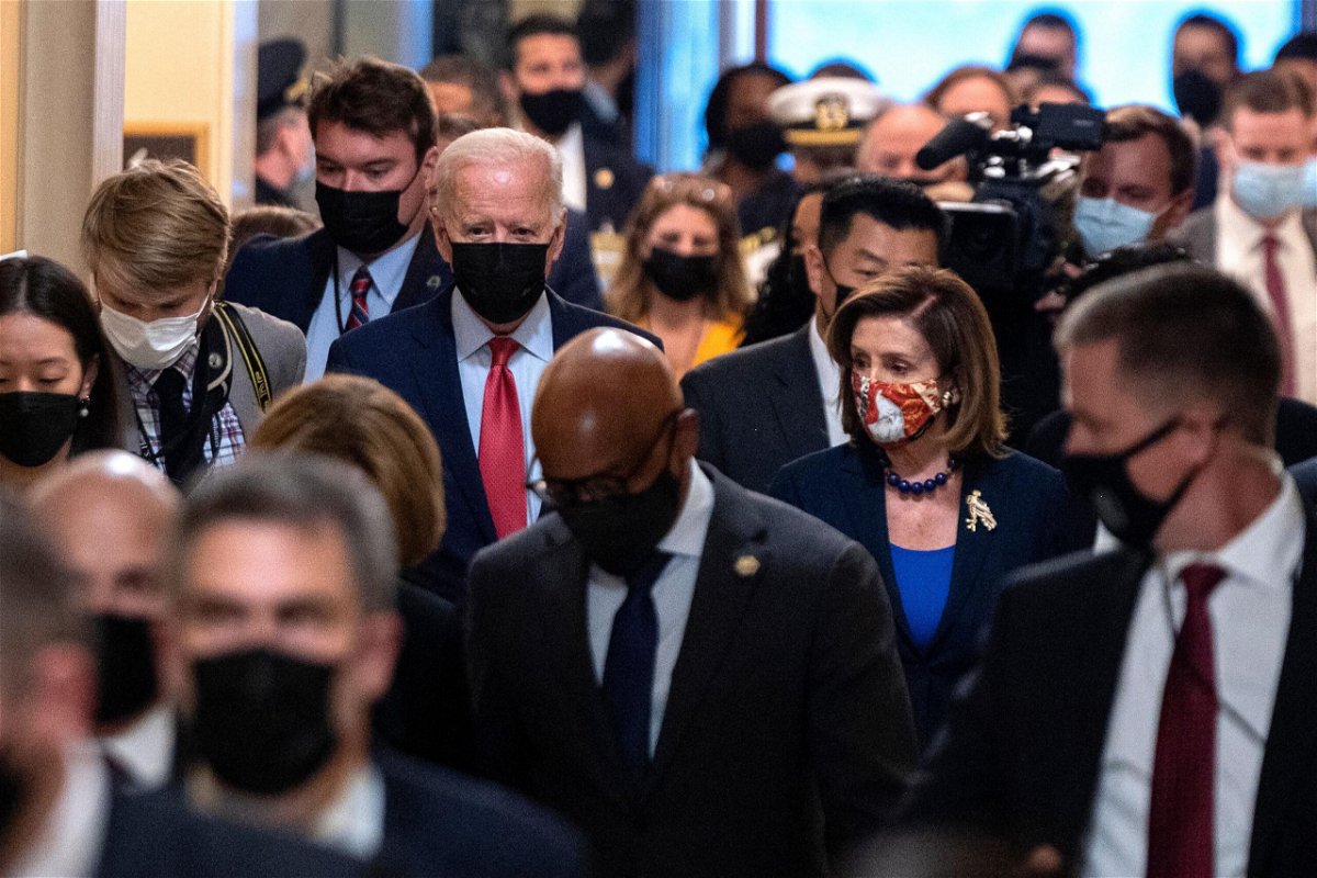 <i>ANDREW CABALLERO-REYNOLDS/AFP/Getty Images</i><br/>House Speaker Nancy Pelosi and President Joe Biden spoke by phone last Tuesday and zeroed in on a strategy for their party's sweeping economic package. Biden and Pelosi are shown here at the US Capitol on October 1