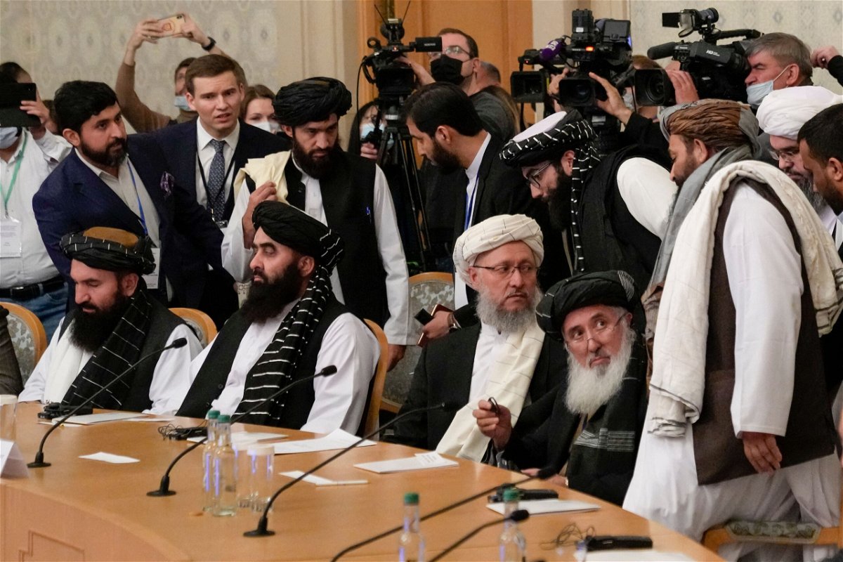 <i>ALEXANDER ZEMLIANICHENKO/AFP/POOL/AFP via Getty Images</i><br/>Deputy Prime Minister of Afghanistan's interim government Abdul Salam Hanafi (center) and members of the Taliban delegation attend an international conference on Afghanistan in Moscow on October 20.