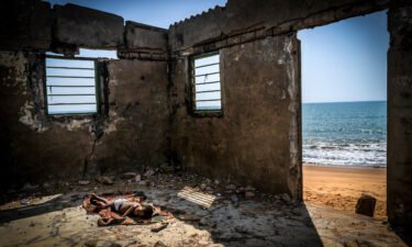 A child sleeps inside his house destroyed by coastal erosion on Afiadenyigba beach. Sea-levels in West-African countries continue to rise and thousands of people have been forced to leave their homes. This haunting image