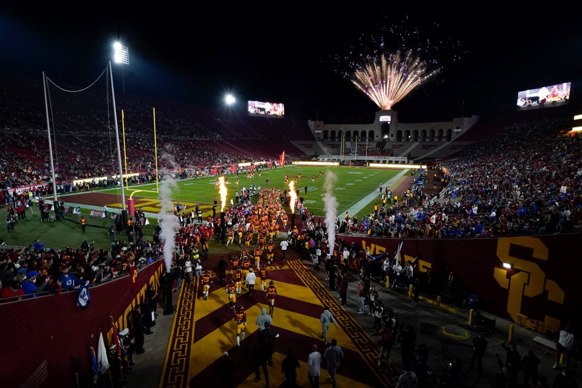 <i>Ashley Landis/AP</i><br/>University of Southern California football players enter the field before an NCAA college football game against BYU in Los Angeles