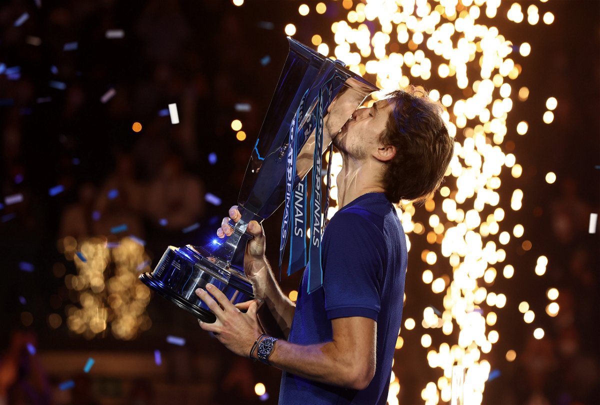 <i>Julian Finney/Getty Images Europe/Getty Images</i><br/>Alexander Zverev celebrates with the ATP Finals trophy.