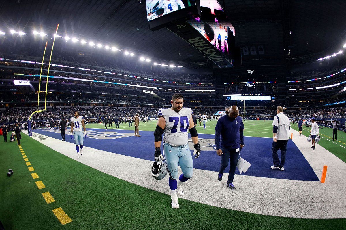 <i>Ron Jenkins/AP</i><br/>The Dallas Cowboys' Zack Martin and Micah Parsons walk off the field after losing against the Las Vegas Raiders.