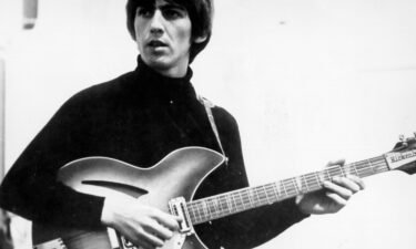George Harrison records on a Rickenbacker electric guitar in the studio in around 1965.